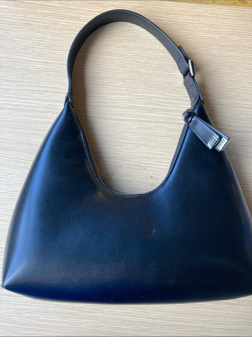 Smooth Black Leather Shoulder Bag with Curved Silhouette